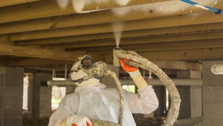 baton rouge insulation company mr green jeans A person in protective gear from an insulation company in Baton Rouge is diligently spraying insulation foam under a wooden floor.